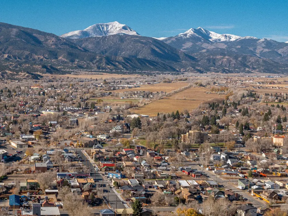 Aerial view of Salida, Colorado, with the snow-capped Collegiate Peaks rising above the town